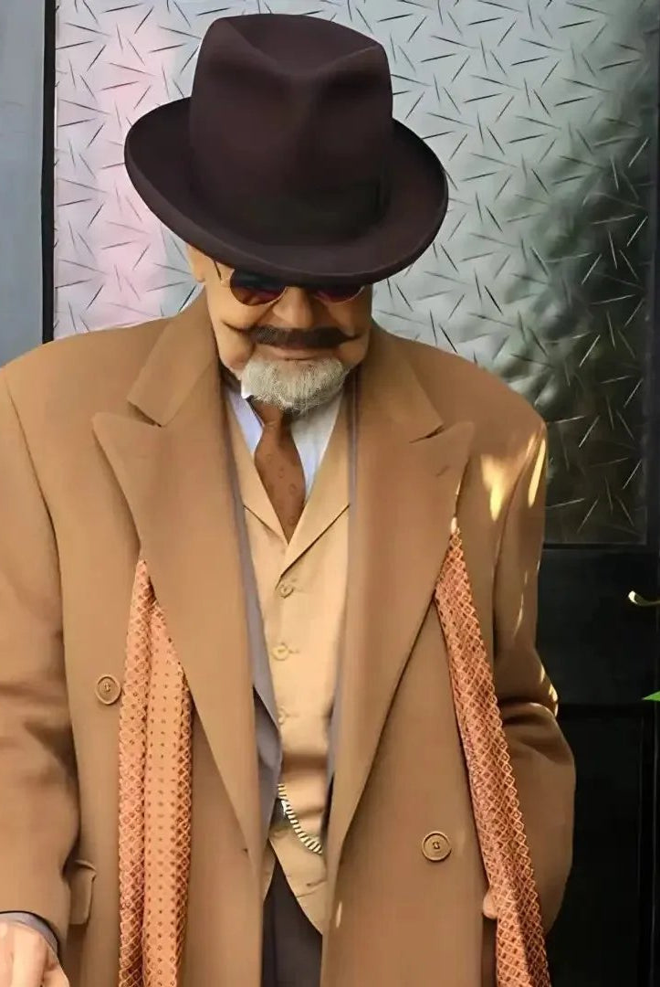 doorstep photo of a well dressed gentleman holding a cane and wearing a beaver homburg fedora