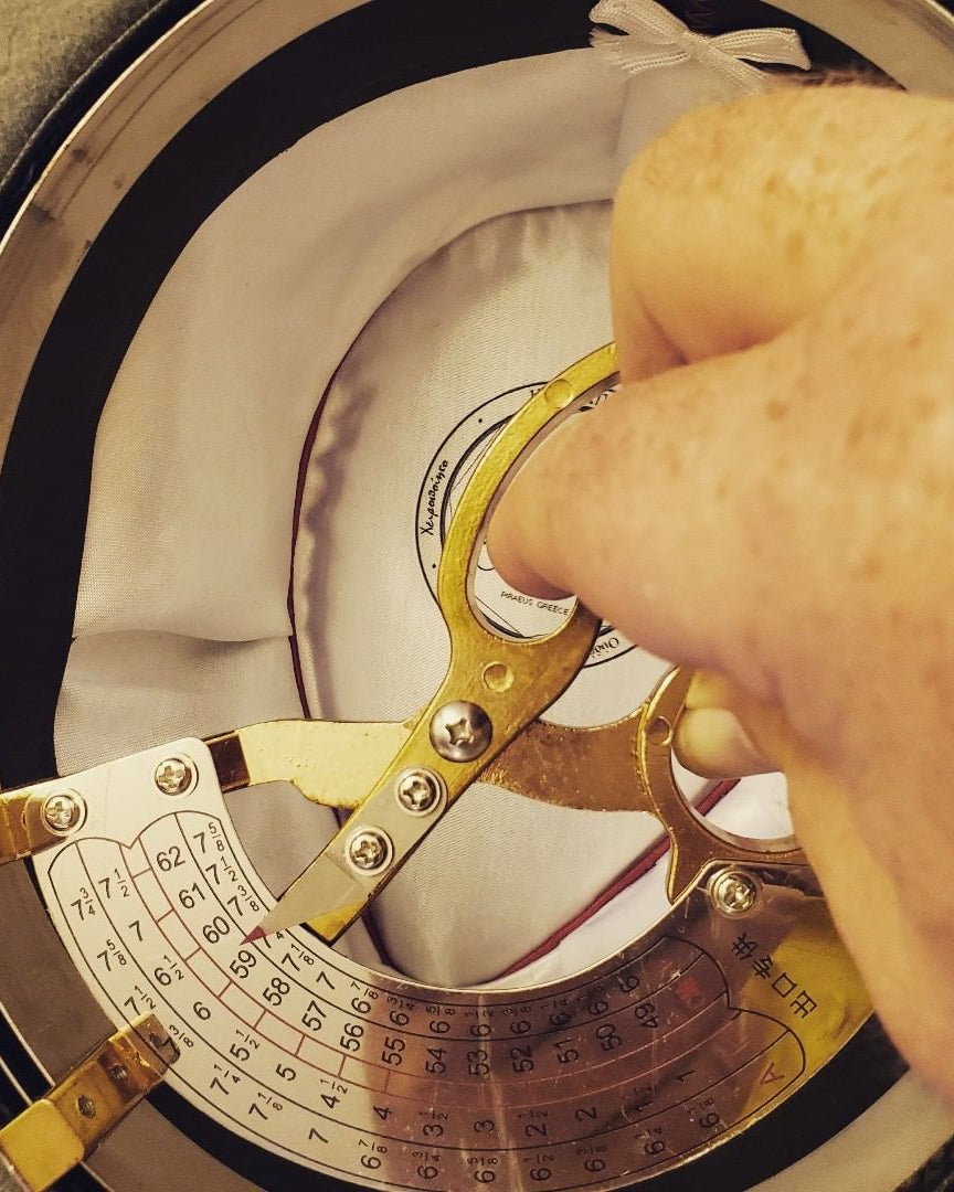 Measuring the inside of an Agnoulita Hats as part of our quality control process