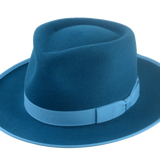 Equinox dark teal fedora with an exclusive teardrop crown design, accentuated by a sky-colored band