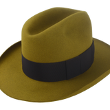 The Miller: A mustard-colored beaver fur felt fedora featuring a smooth finish, 5 1/4" cattleman crown, and black grosgrain ribbon hatband | Agnoulita Hats