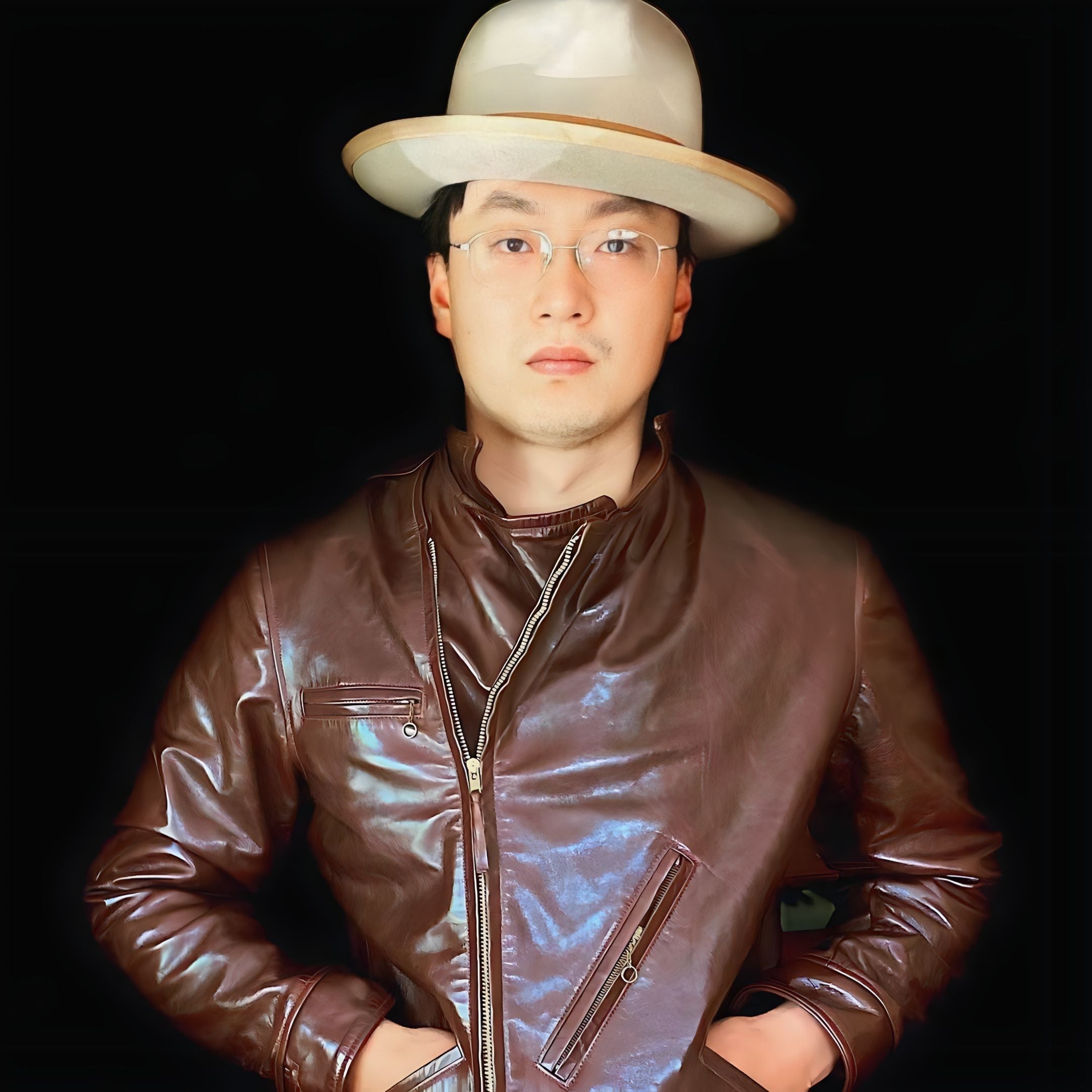 Asian young man wearing a brown leather jacket and a classic-style Agnoulita fedora
