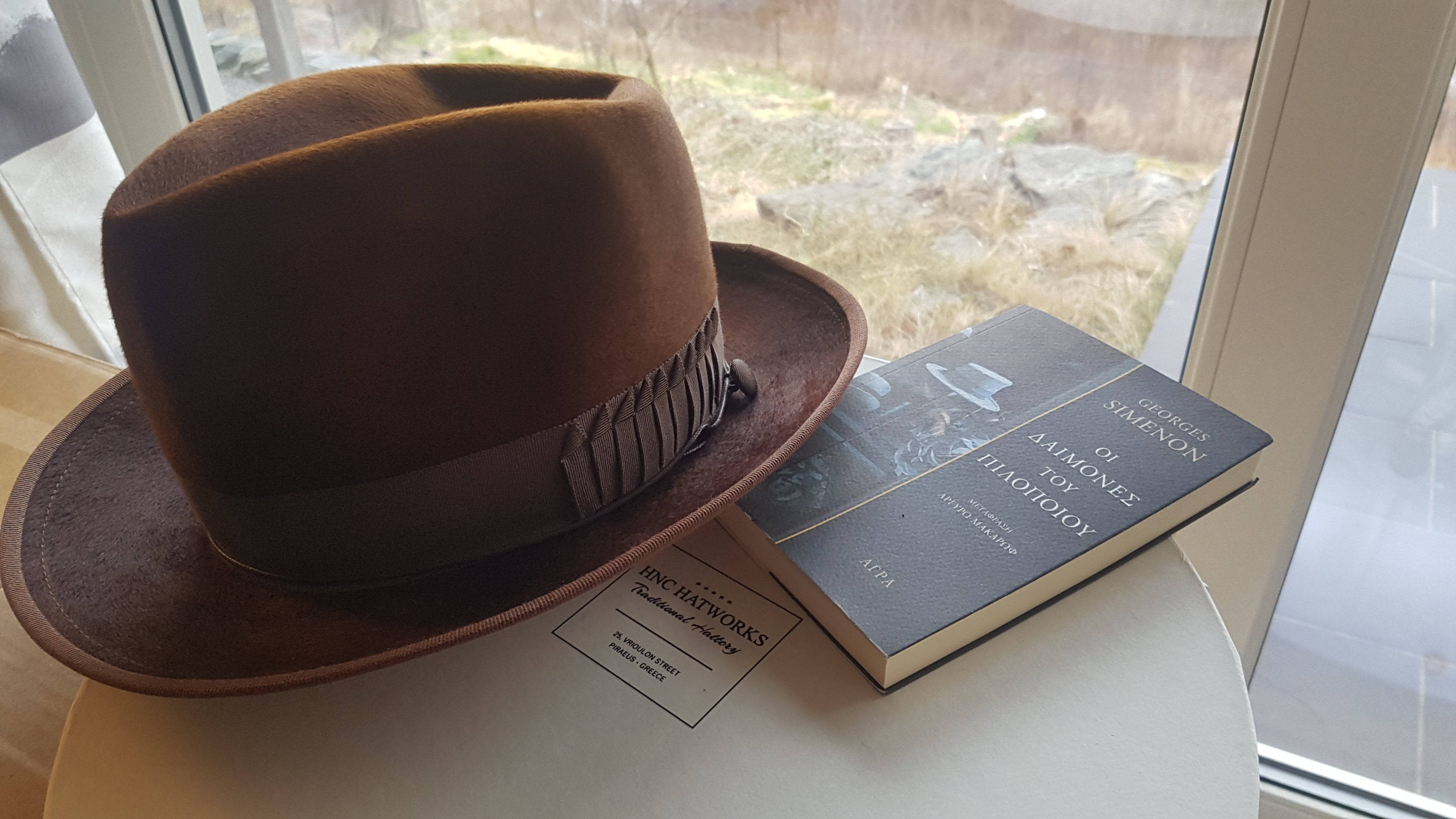 Custom Agnoulita fedora on top of a best seller book