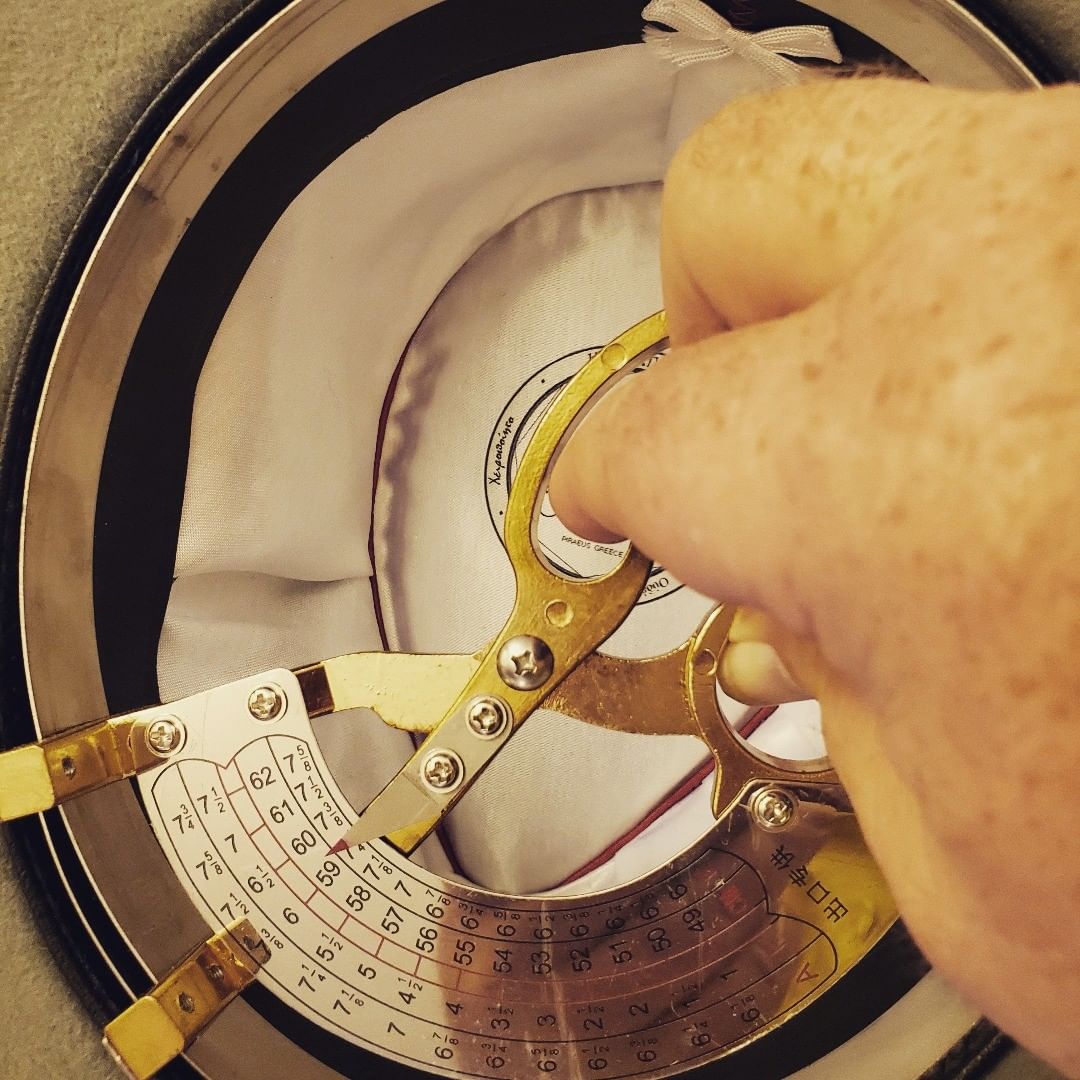 Measuring the inside of an Agnoulita Hats as part of our quality control process