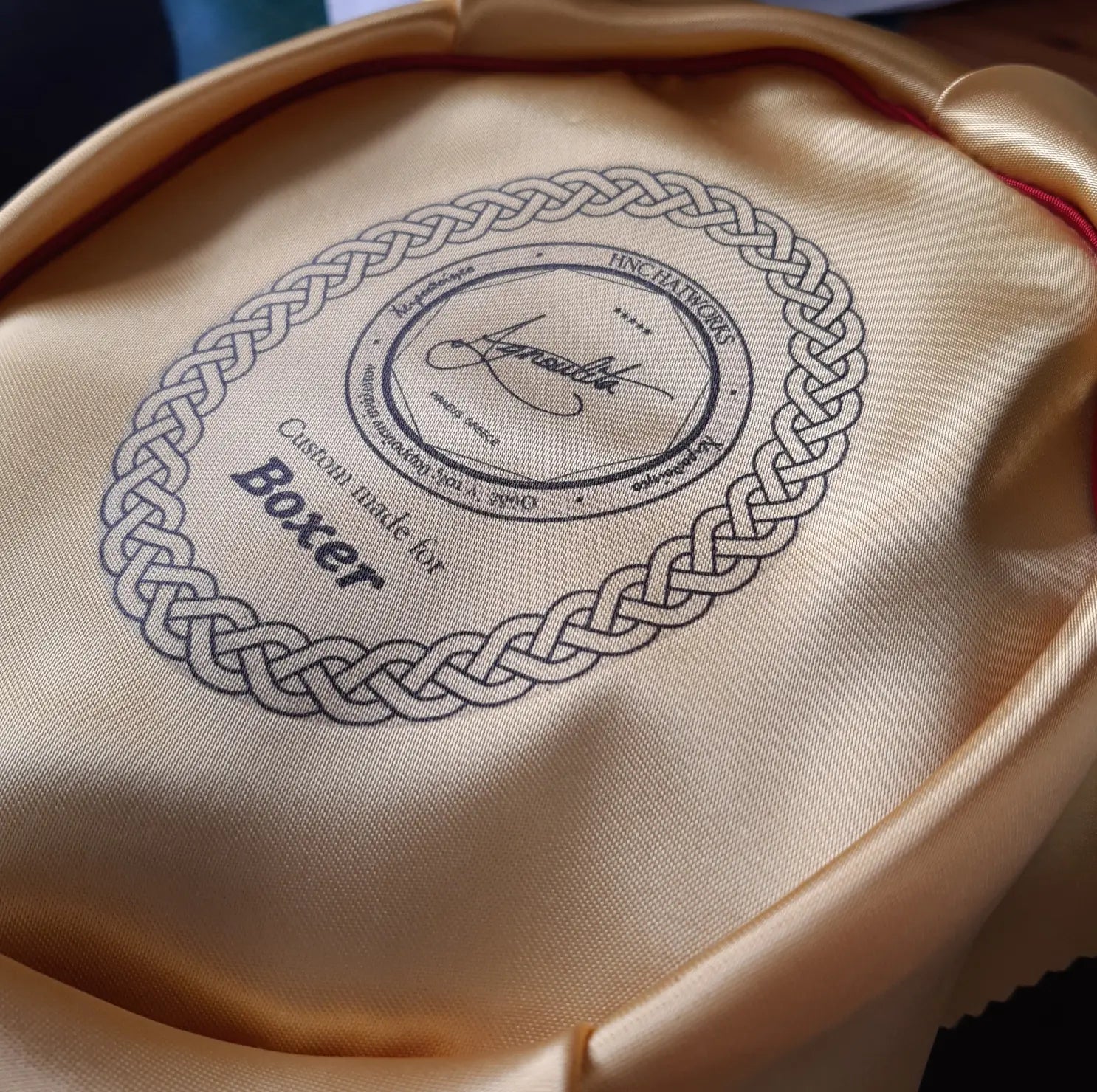 Inside view of a hat showing the brand label 'Agnoulita' with a signature, stating 'Custom-made for Boxer'
