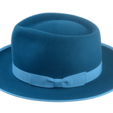 Snapshot of the 1" sky grosgrain ribbon hatband circling the Equinox dark teal fedora